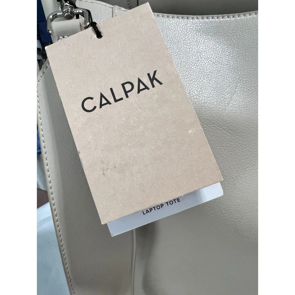 CalPak Taupe Leather Tote Bag with Adjustable Strap. Tags are no longer intact.